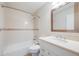 Bright bathroom features a shower and tub combination with a white vanity at 19294 E Warren Pl, Aurora, CO 80013