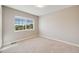 Neutral bedroom features a carpeted floor, a window, and base molding at 19294 E Warren Pl, Aurora, CO 80013