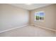 Neutral bedroom features a carpeted floor, a window, and base molding at 19294 E Warren Pl, Aurora, CO 80013