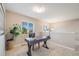 Bright office space with a modern desk, plant, and natural light from the windows at 19294 E Warren Pl, Aurora, CO 80013