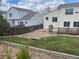Backyard with lawn, wood fence, and deck looking at adjacent homes at 20626 Willowbend Ln, Parker, CO 80138
