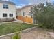 Manicured grass lawn and wood fence in backyard with landscaping at 20626 Willowbend Ln, Parker, CO 80138