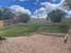 Tiered and fenced backyard with lawn and graveled area and landscaping at 20626 Willowbend Ln, Parker, CO 80138