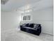 Finished basement area with a comfortable sofa and ample natural light from the window at 20626 Willowbend Ln, Parker, CO 80138