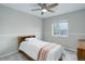 Bedroom includes a ceiling fan and a bright window at 20626 Willowbend Ln, Parker, CO 80138