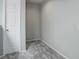 Empty bedroom or closet with carpeted floors and door at 20626 Willowbend Ln, Parker, CO 80138
