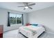 Bright bedroom with a ceiling fan and a large window overlooking the backyard at 20626 Willowbend Ln, Parker, CO 80138