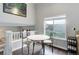 Bright dining area features a small table and a window overlooking the backyard at 20626 Willowbend Ln, Parker, CO 80138