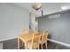 Inviting dining room with dark hardwood floors and a stylish light fixture at 20626 Willowbend Ln, Parker, CO 80138