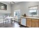 Bright eat-in kitchen featuring wooden cabinets, tile countertops, and a window with a view at 20626 Willowbend Ln, Parker, CO 80138