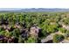 Picturesque aerial view of condos nestled among mature trees with mountain views at 6110 Habitat Dr # 2, Boulder, CO 80301
