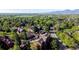 An aerial view of a community with lush greenery, views of the mountains, and well-maintained streets at 6110 Habitat Dr # 2, Boulder, CO 80301