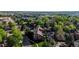 Aerial view of condo complex nestled among lush greenery and mature trees, highlighting the residential neighborhood at 6110 Habitat Dr # 2, Boulder, CO 80301
