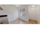 Dining area with wood-look floors, a window, and a coat rack near the entry door at 6110 Habitat Dr # 2, Boulder, CO 80301