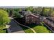 Well-maintained three-story condo building with balconies and lush green surroundings in a residential neighborhood at 6110 Habitat Dr # 2, Boulder, CO 80301