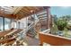 Exterior angle view of wooden staircase leading to apartments within a multifamily property on a sunny day at 6110 Habitat Dr # 2, Boulder, CO 80301