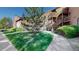 Exterior side view of building featuring lush greenery, side walk, and timber framed staircases, making it ideal for outdoor living at 6110 Habitat Dr # 2, Boulder, CO 80301