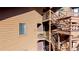 Exterior view of the brown building with wooden stairs leading to the different levels of the complex at 6110 Habitat Dr # 2, Boulder, CO 80301