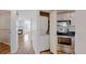Kitchen featuring stainless steel appliances, granite counters, and a view to the living room with fireplace at 6110 Habitat Dr # 2, Boulder, CO 80301