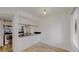 Modern kitchen featuring stainless steel appliances, granite countertops, and wood-look vinyl floors at 6110 Habitat Dr # 2, Boulder, CO 80301