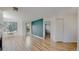 Bright living room features wood-style floors and door to balcony at 6110 Habitat Dr # 2, Boulder, CO 80301