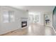 Bright living room with a fireplace and wood-style floors at 6110 Habitat Dr # 2, Boulder, CO 80301
