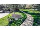 Willow Brook community sign with a stone marker, lush landscaping, and a paved walkway at 6110 Habitat Dr # 2, Boulder, CO 80301
