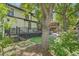 Enjoy outdoor living in this backyard featuring a multilevel deck, mature trees, and a lush lawn at 785 Fillmore St, Denver, CO 80206