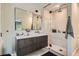 Modern bathroom featuring sleek floating vanity, a large mirror and a walk-in shower at 785 Fillmore St, Denver, CO 80206