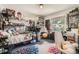 Eclectic bedroom featuring a loft bed, colorful decor, and plenty of personality at 785 Fillmore St, Denver, CO 80206