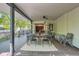 The beautiful outdoor deck offers a covered dining area with an open view into the home's kitchen through french doors at 785 Fillmore St, Denver, CO 80206