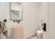 Modern powder room featuring a vessel sink, sleek fixtures, and minimalist design at 785 Fillmore St, Denver, CO 80206