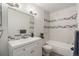 Updated bathroom featuring tiled walls, modern fixtures, and vanity at 14704 E 2Nd Ave # E307, Aurora, CO 80011