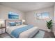 Bright bedroom with a large window and comfortable furnishings at 14704 E 2Nd Ave # E307, Aurora, CO 80011