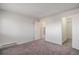 Spacious bedroom featuring neutral carpeting and a large closet at 14704 E 2Nd Ave # E307, Aurora, CO 80011