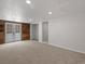 Basement featuring an exterior door and closet space at 3398 Wadsworth Blvd, Wheat Ridge, CO 80033