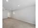 Basement space featuring neutral walls and carpet and recessed lighting at 3398 Wadsworth Blvd, Wheat Ridge, CO 80033