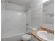 This bright bathroom has a shower-tub combo and a single sink vanity at 3398 Wadsworth Blvd, Wheat Ridge, CO 80033