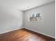 Bedroom with hardwood floors and a window providing natural light at 3398 Wadsworth Blvd, Wheat Ridge, CO 80033
