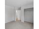 Bedroom featuring neutral colored walls, carpet, and closet at 3398 Wadsworth Blvd, Wheat Ridge, CO 80033