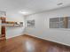 This dining room features wood floors and large windows for ample natural light at 3398 Wadsworth Blvd, Wheat Ridge, CO 80033