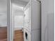 Laundry area with stackable washer/dryer next to bathroom with shower/tub combo at 3398 Wadsworth Blvd, Wheat Ridge, CO 80033