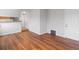 Open floor plan with wood floors leading to an exterior door at 3398 Wadsworth Blvd, Wheat Ridge, CO 80033