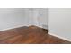 This living room features wood floors, light gray walls, and an access door at 3398 Wadsworth Blvd, Wheat Ridge, CO 80033