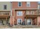 The backyard of the townhome features individual patios and private balconies at 9747 W Cornell Pl, Lakewood, CO 80227