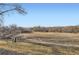 Scenic backyard view overlooking a beautiful open field and a treeline at 9747 W Cornell Pl, Lakewood, CO 80227