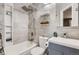 Bathroom featuring gray tiling, modern fixtures, a shower-tub combination, and a neutral vanity at 9747 W Cornell Pl, Lakewood, CO 80227