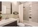 Modern bathroom featuring a stylish vanity, contemporary fixtures, and a shower-tub combination at 9747 W Cornell Pl, Lakewood, CO 80227