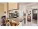 Modern kitchen featuring a breakfast bar and sleek appliances at 9747 W Cornell Pl, Lakewood, CO 80227