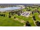 Scenic aerial view of a golf course near the neighborhood with a large lake nearby at 5185 N Meade Street St, Denver, CO 80221
